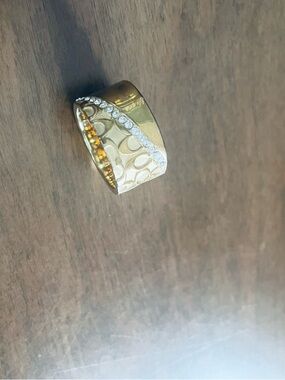Coach Gold-Tone Wide Signature Logo Ring with Crystal Band
